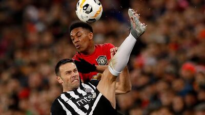Partizan Belgrade's Bojan Ostojic and Anthony Martial of Manchester United. PA