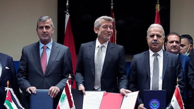 Lebanon's Energy Minister Walid Fayyad, centre, with Jordanian Energy Minister Saleh Kharabsheh, left, and Syria's Electricity Minister Ghassan Al Zamil, signed a deal to export electricity from Jordan to Lebanon through Syria at a meeting in Beirut on January 26. AP Photo