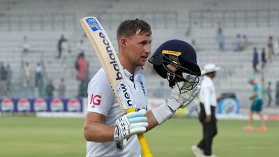 England's Joe Root, who scores 176 not out, acknowledges crowd and teammates as he walk off the field on the end of game of the third day of the first test cricket match between Pakistan and England, in Multan, Pakistan, Wednesday, Oct. 9, 2024. (AP Photo / Anjum Naveed)