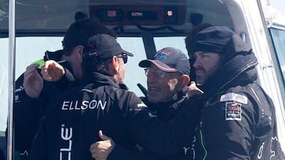 Larry Ellison, the Oracle Corporation chief executive, is embraced after Oracle Team USA won the fourth race of the America's Cup. Eric Risberg / AP Photo