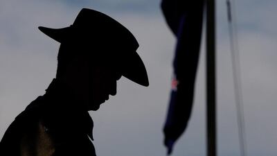 A soldier stands in silence during a wreath laying ceremony yesterday in Longreach, Australia. The 2015 Anzac Troop Train Re-Enactment commemorates the 100 year celebration of Anzac, the steam train with nine authentic refurbished carriages will travel from Winton to Brisbane stopping overnight at Longreach, Emerald, Rockhampton and Maryborough. 225 passengers, many of whom are family members of service men and women, will stop along the way and pay their respects to those who served during re-enactment ceremonies. Lisa Maree Williams / Getty Images