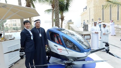 The Dubai RTA chief Mattar Al Tayer with a representative of the Chinese driverless flying car, or AAV, maker Ehang. “We are working hard to start operation of the AAV this July,” said Mr Al Tayyer. Courtesy APCO Worldwide