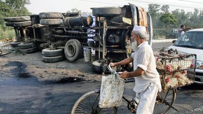 New Delhi hopes to improve chances of survival for road accident victims by offering financial rewards to passers-by who stop to help and take them to hospital. Prakash Singh / AFP