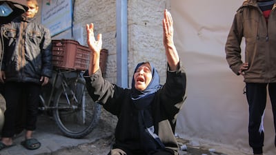 A Palestinian woman reacts after an Israeli air strike in Deir Al-Balah. Bloomberg