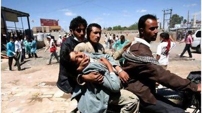 Yemeni medics on Sunday rush a wounded Yemeni protester away from trouble following clashes with security forces in Sanaa as demonstrators demanded president Ali Abdullah Saleh quit.