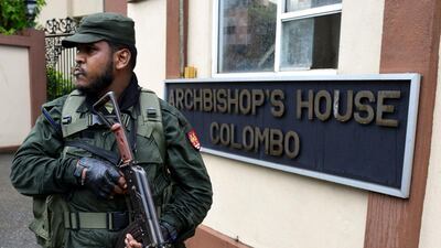A Sri Lankan soldier stands guard outside the residence of Catholic Archbishop Malcolm Ranjith, in Colombo on April 30, 2019. AFP