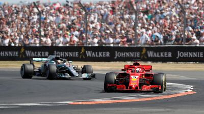 Ferrari's Sebastian Vettel leads Mercedes-GP's Lewis Hamilton on his way to victory at the British Grand Prix. Action Images via Reuters