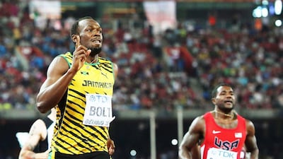 Usain Bolt celebrates after winning the 200-metre world title ahead of Justin Gatlin, right. Srdjan Suki / EPA