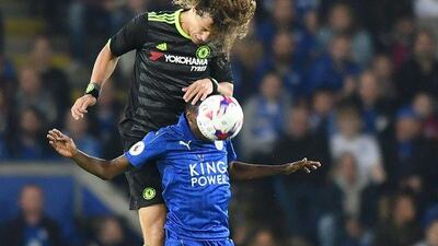 Chelsea’s David Luiz, left, jumps to head the ball over Leicester City’s Ahmed Musa. Anthony Devlin / AFP