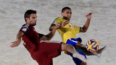 Russia and Brazil in beach soccer action at the 2014 tournament. Satish Kumar / The National