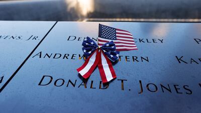 A U. S. flag is seen on the 9/11 Memorial on the 20th anniversary of the September 11 attacks in Manhattan, New York City, U. S. EPA