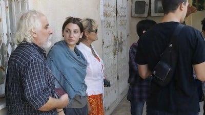 Friends of murdered Italian peace activist Vittorio Arrigoni stand inside the grounds of the military court building in Gaza City.