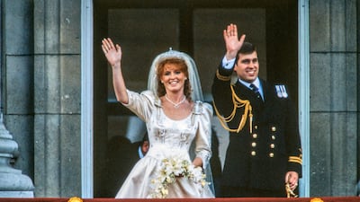 The just-married royal couple Sarah Ferguson and Prince Andrew wave from the balcony of Buckingham Palace, London, in 1986