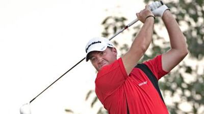 Peter Hanson tees off on the 18th hole of the Dubai World Championship yesterday. He leads by a shot after the first round.