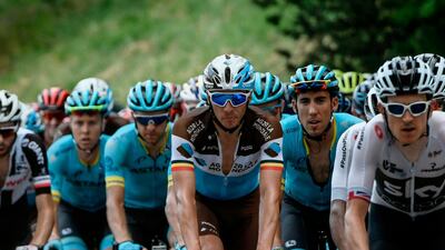 France's Romain Bardet, centre, rides in the pack during the 10th stage of the Tour de France between Annecy and Le Grand-Bornand. Philippe Lopez / AFP