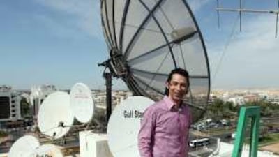 Tariq Chebaro lives in a low-rise apartment building in Abu Dhabi and has trouble getting a good satellite signal because of high-rise construction near his building.