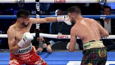 Jose Ramirez lands a punch on Josh Taylor. AFP
