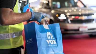 The drive-in cinema is making a comeback at Mall Of The Emirates, and a large screen has been assembled in the shopping centre's upper parking lot, on level 3, right underneath Ski Dubai's slope. Patrons take position, switch off their engines and settle in for the film. Reem Mohammed / The National