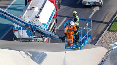 A cleaning crew prepares to sanitise a canopy at the track. Victor Besa / The National