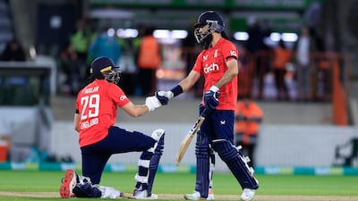 Moeen Ali of England congratulates teammate Dawid Malan on his half century. Getty