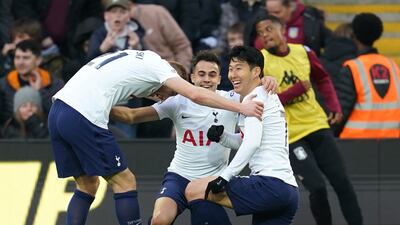 Son Heung-min (right) celebrates with team-mates after scoring the third goal. PA