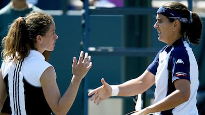 Guillermo-Garcia Lopez not shaking hands with Lukas Rosol would not be a first for tennis. Patty Schnyder , left, left Conchita Martinez hanging after their match during the Family Circle Cup on April 17, 2004 in Charleston, South Carolina. Matthew Stockman / AFP