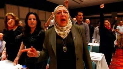 Syrian opposition activists chant 'Freedom, freedom' in the Turkish resort of Antalya yesterday during the opening session of a three-day meeting to discuss democratic change and voice support for a simmering revolt against President Bashar al Assad's regime