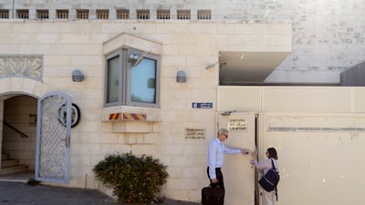Workers enter the British Consulate in Jerusalem. Getty Images