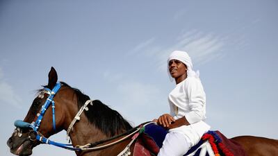 A rider looks on as others ready themselves. Getty