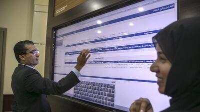 Through touchscreen technology, users can inquire about the status of a certain case by entering its number or the whereabouts of a case file. Silvia Razgova / The National