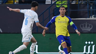 Al Batin's Bassam Al Hurayji fights for the ball with Al Nassr's Cristiano Ronaldo. AFP