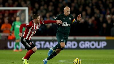 John Fleck of Sheffield United challenges Newcastle's Jonjo Shelvey. Getty