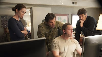 Kate Macer, Josh Brolin, standing, and Benicio del Toro, right, in Sicario. Photo by Richard Foreman Jr SMPSP
