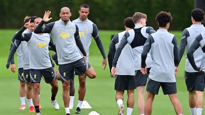 Liverpool's Brazilian midfielder Fabinho giving a wave at training. AFP