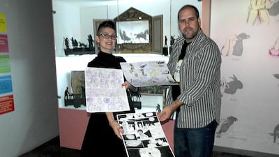 Judges Karien Mulder and Brett Benson with the some of the competition entries.