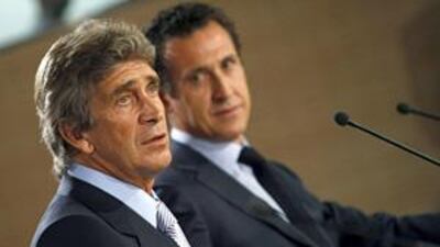 Manuel Pellegrini, left, is officially unveiled today as thew new coach of Spanish giants Real Madrid by the club's new director Jorge Valdano.