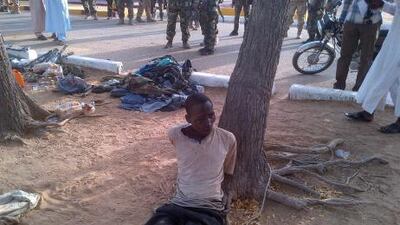 Bakura Ibrahim, a suspected member of an Islamist extremist group, is arrested by soldiers and tied to a tree in Bama, Nigeria.