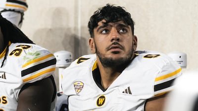 A seamstress in Kalamazoo, home to WMU, made the Arabic badges for Mustafi Al-Garawi's jerseys.