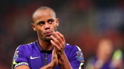 Vincent Kompany of Manchester City applauds the fans after their 4-1 Premier League win against Stoke City on Wednesday night. Alex LIvesey / Getty Images