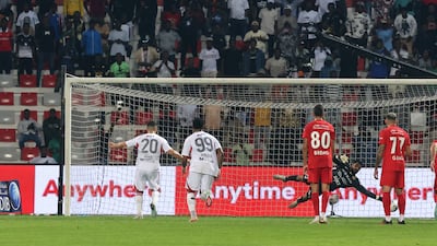 Nabil Fekir of Al Jazira scores from the penalty spot.