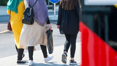 Two young women wearing headscarves at Germany's border with Poland. Getty Images