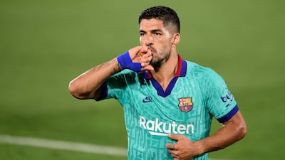 Luis Suarez celebrates after scoring a goal against Villarreal on July 5. AFP