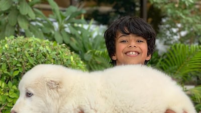 "Tiny" the puppy is held by Mohammed bin Ahmed Jaber Al Harbi, or "Maj", the son of Sheikh Hamdan's long-time friend Ahmed Jaber Al Harbi. Instagram / @faz3