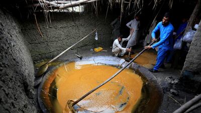 Afghan men make sweets at traditional sweets factory in Nangarhar province, Afghanistan. Reuters
