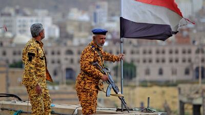 Fighters loyal to Yemen's Houthi rebels stand guard in Sanaa on March 26. AFP