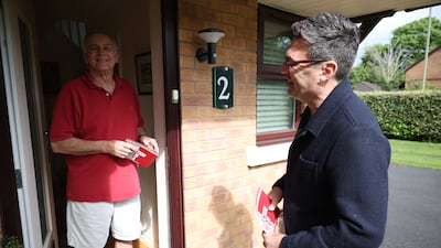 Mr Burnham speaks to a resident in Ashton-in-Makerfield as he goes door-to-door canvassing in May