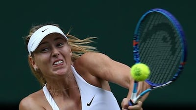 Russia's Maria Sharapova returns to US player Coco Vandeweghe during their women's quarter-finals match on Day 8 of the 2015 Wimbledon Championships at the All England Club, southwest London, on July 7, 2015. AFP PHOTO / JUSTIN TALLIS