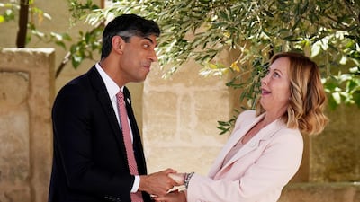 Mr Sunak is greeted by Ms Meloni at Borgo Egnazia. Getty Images