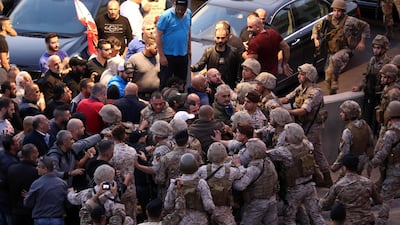 Backers of the Free Patriotic Movement founded by the Lebanese president scaffle with soldiers during a rally in his support on a road leading to the presidential palace in Baabda near the capital Beirut. AFP