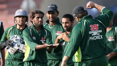 Mohsin Anwer, centre, of Phoenix Medicine celebrates after taking the wicket of Arfan Haider in the Bukhatir cricket final between Phoenix Medicine vs Abu Dhabi Gymkhana at Sharjah Cricket Stadium in Sharjah. He took three wickets in this match.